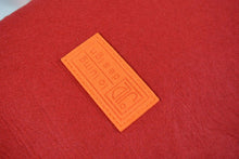 Load image into Gallery viewer, orange harakeke weave on red · red backpack