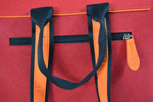 Load image into Gallery viewer, orange harakeke weave on red · red backpack