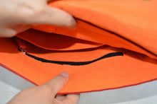 Load image into Gallery viewer, orange harakeke weave on red · red backpack