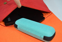 Load image into Gallery viewer, orange harakeke weave on red · red backpack